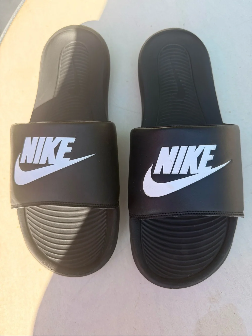 Men’s Nike Black Slides with White Logo